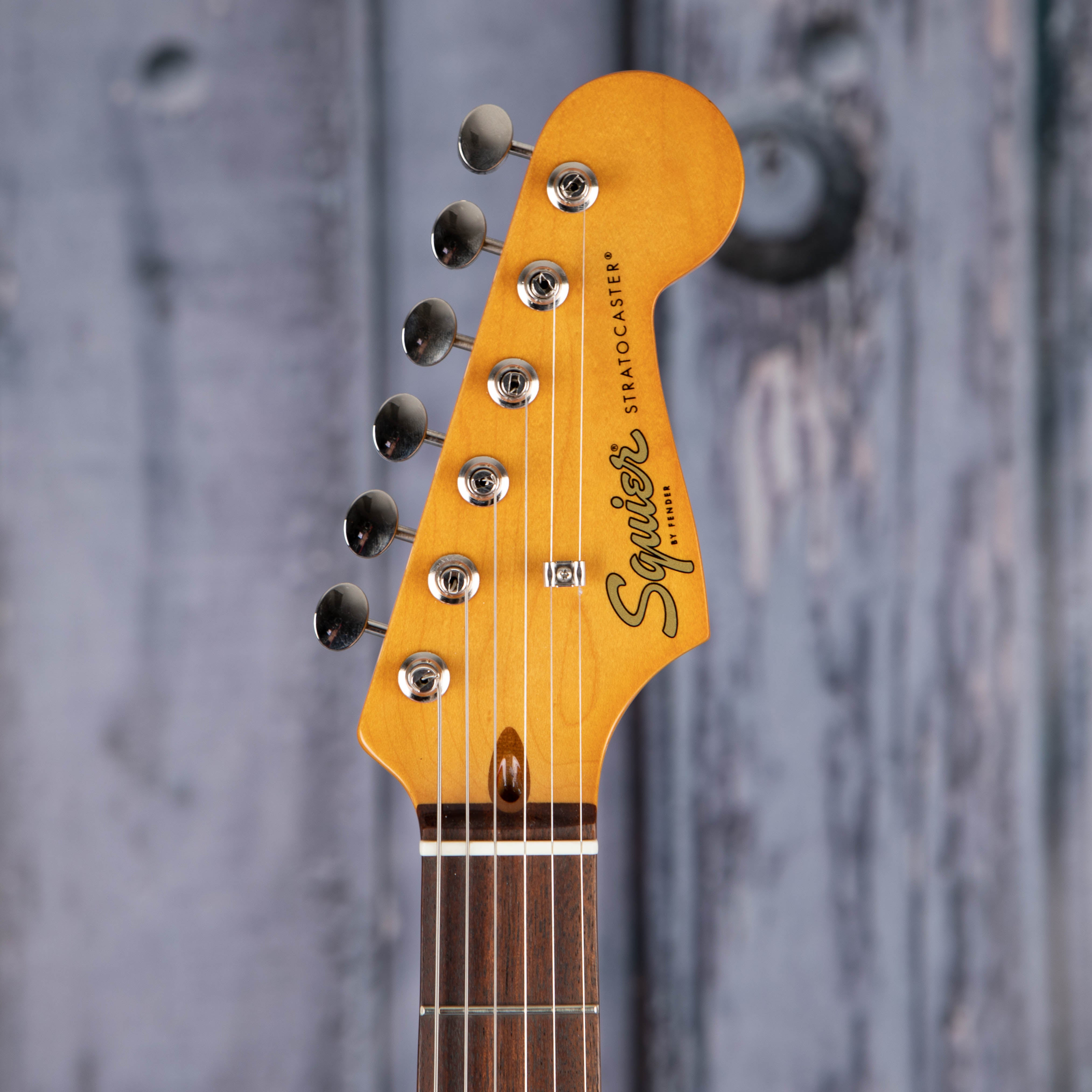 Squier Classic Vibe '60s Stratocaster Electric Guitar, Candy Apple Red, front headstock