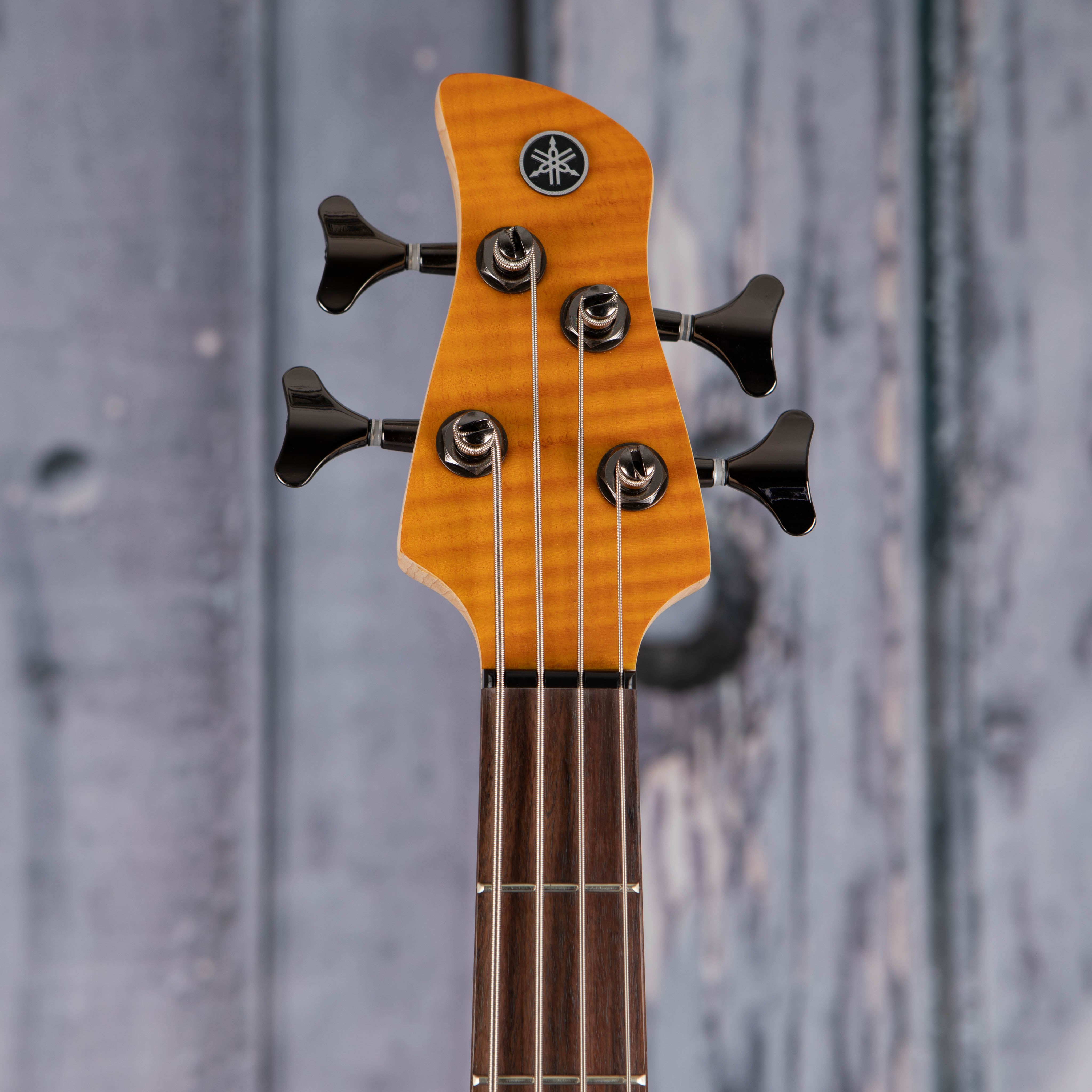 Used Yamaha TRBX604FM Electric Bass Guitar, Matte Amber, front headstock