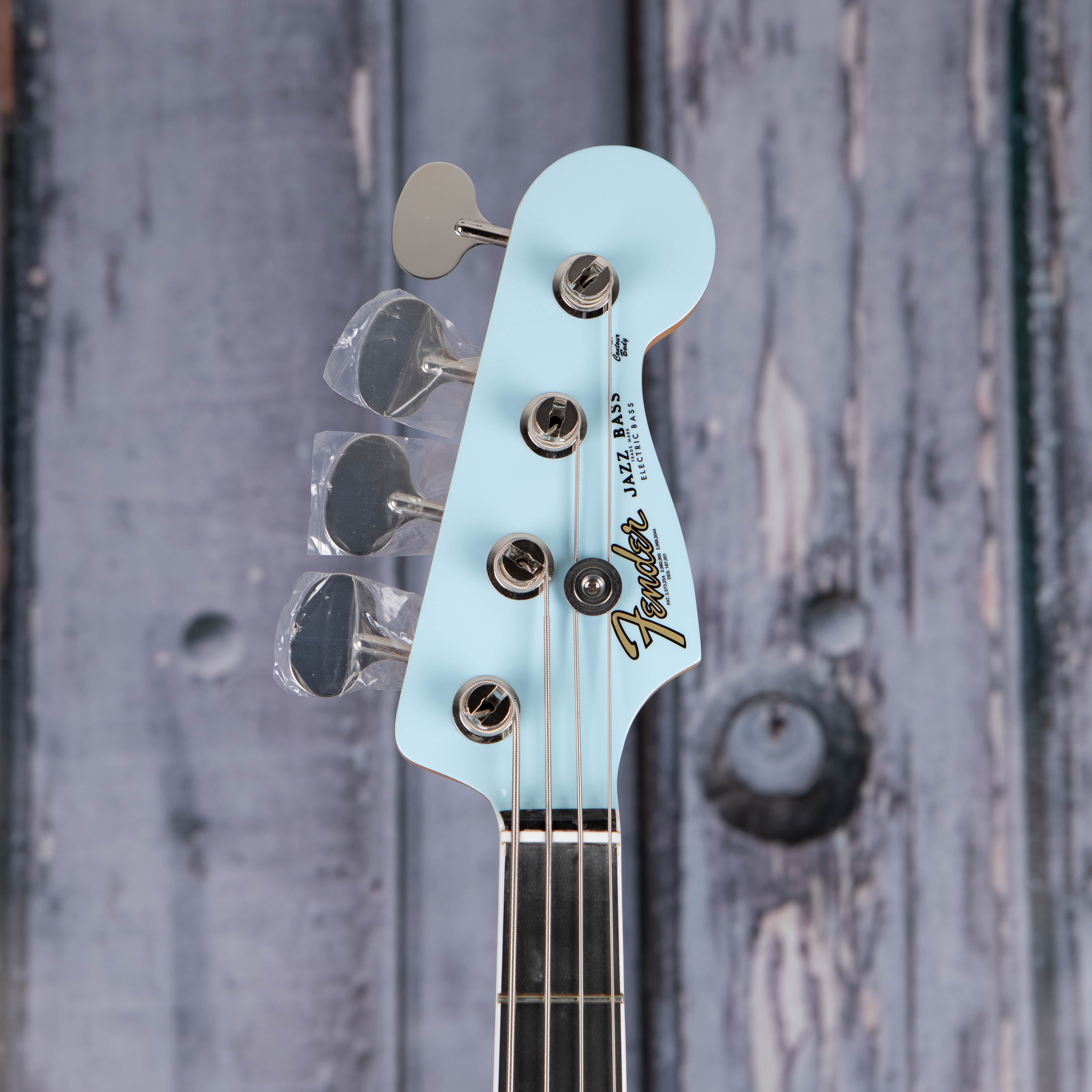 Fender Gold Foil Jazz Bass Guitar, Sonic Blue, front headstock