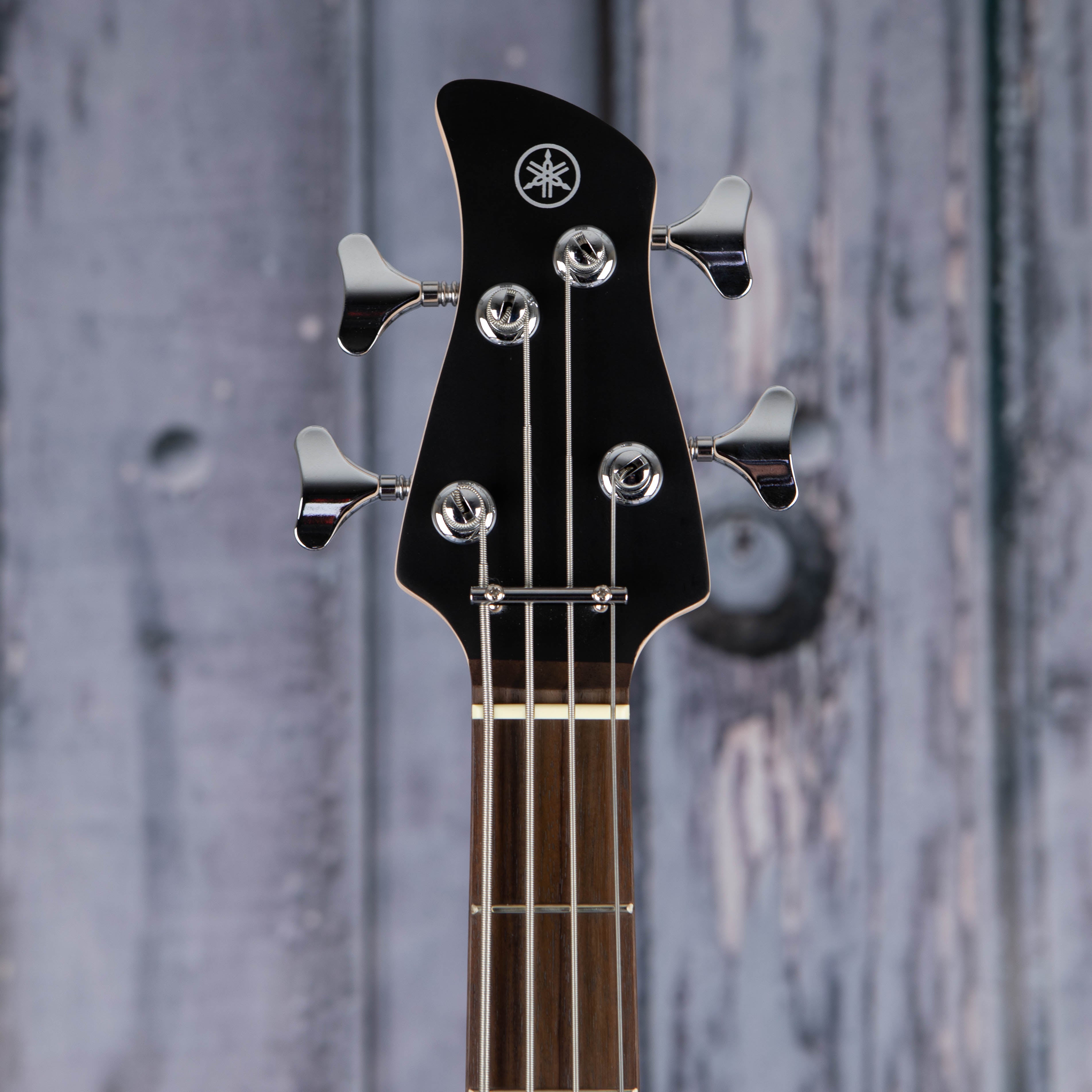 Yamaha TRBX174 Electric Bass Guitar, Metallic Red, front headstock